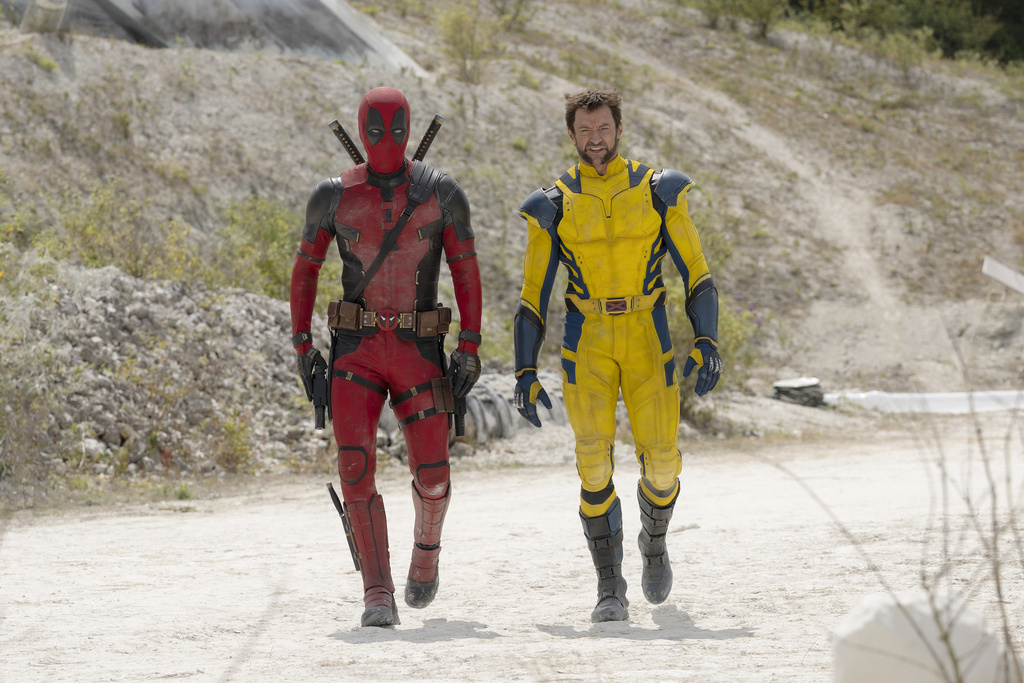 This image released by 20th Century Studios/Marvel Studios shows Ryan Reynolds as Deadpool/Wade Wilson and Hugh Jackman as Wolverine/Logan in a scene from "Deadpool & Wolverine."