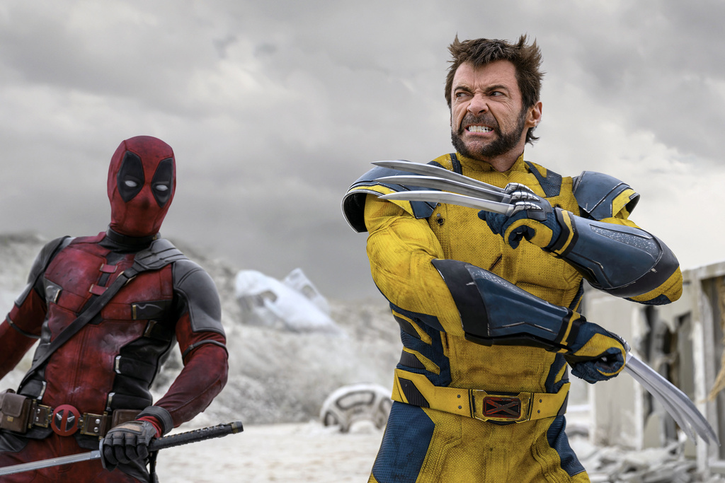 This image released by 20th Century Studios/Marvel Studios shows Ryan Reynolds as Deadpool/Wade Wilson, left, and Hugh Jackman as Wolverine/Logan in a scene from "Deadpool & Wolverine."