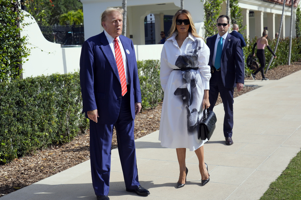 Former president Donald Trump and wife Melania outside their polling location.