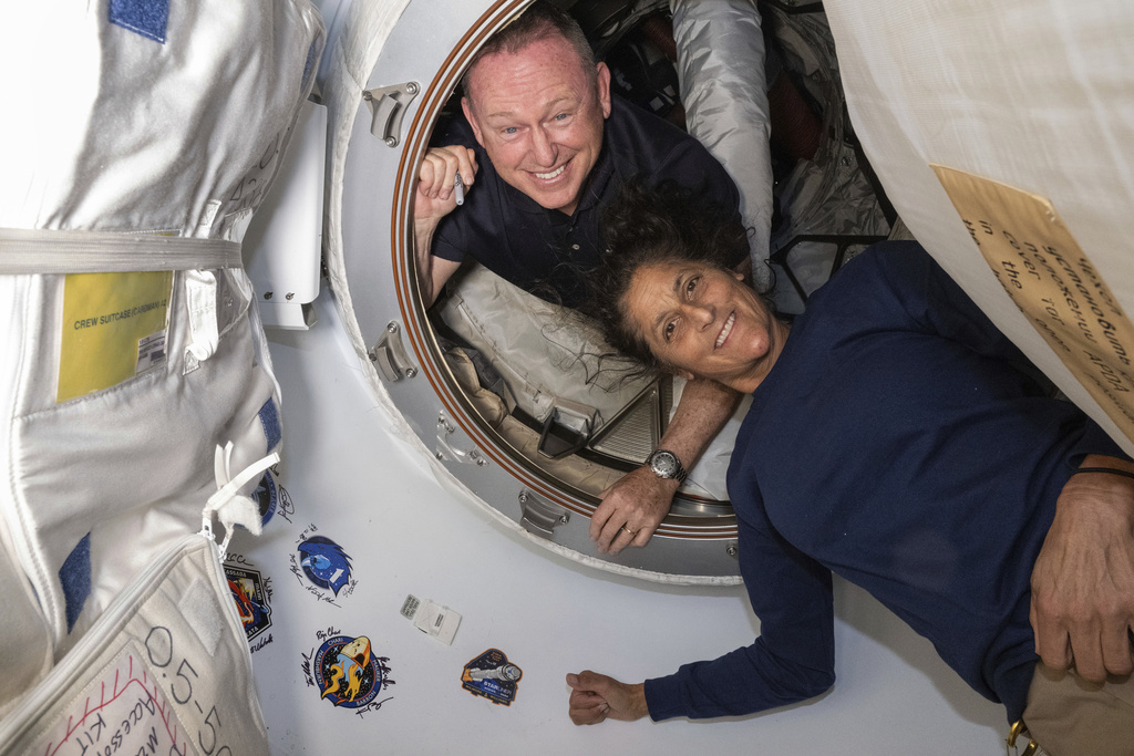 Boeing Crew Flight Test astronauts Butch Wilmore, left, and Suni Williams, right, pose for a portrait