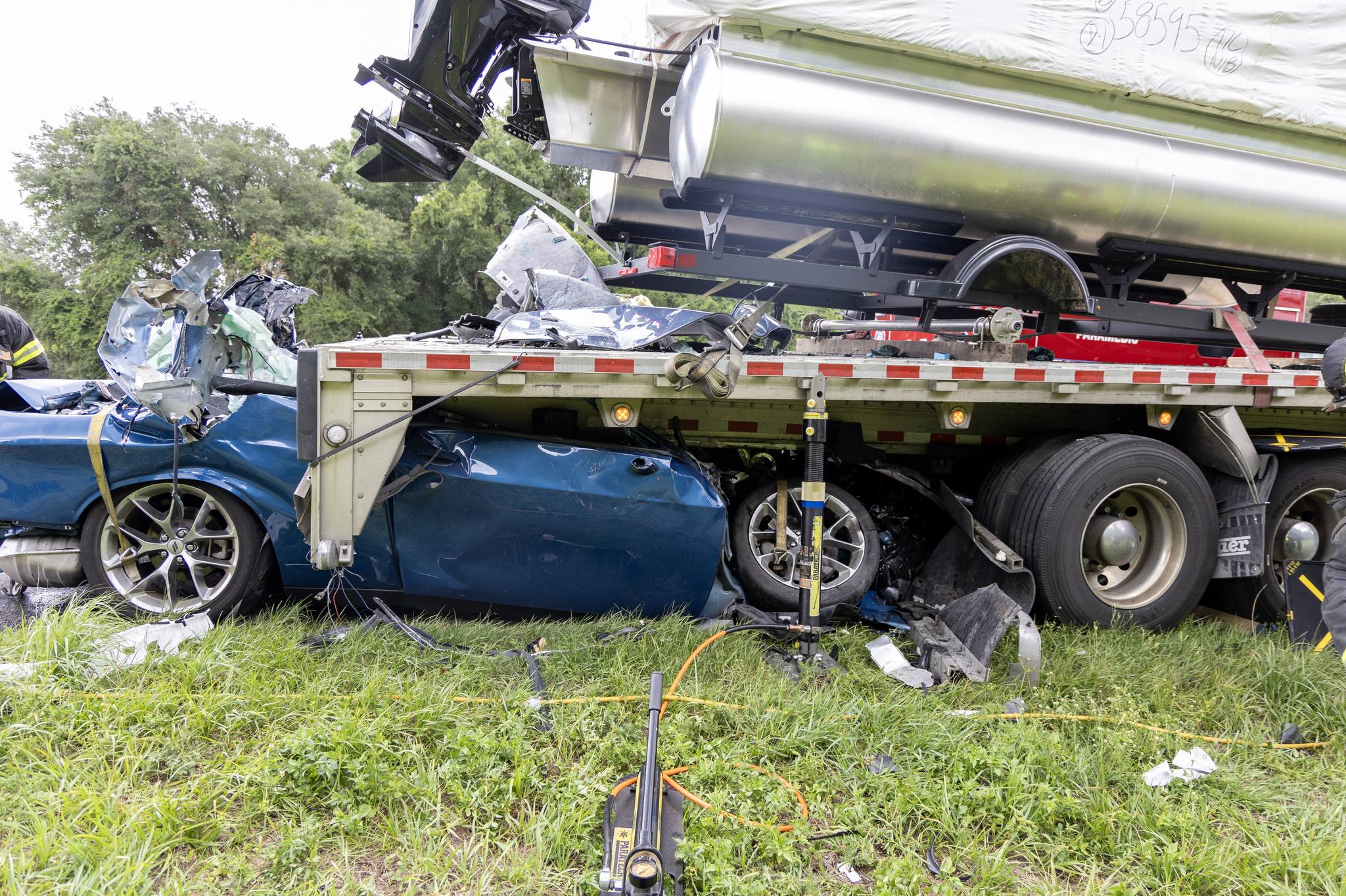 Deadly I-75 southbound wreck leaves sedan pinned underneath