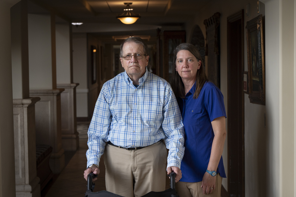 William Bortz, left, stands alongside his daughter, Ave Williams, at his senior living center, at his senior living center, Friday, May 17, 2024, in San Diego.