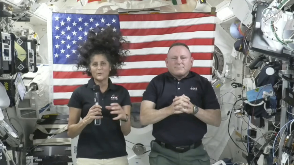 In this image from video provided by NASA, astronauts Suni Williams, left, and Butch Wilmore give a news conference aboard the International Space Station on Wednesday, July 10, 2024.