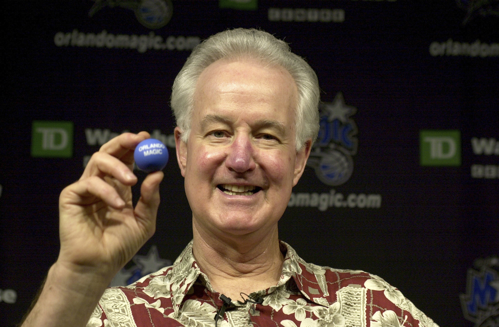 Image of Orlando Magic senior vice president Pat Williams holding a signature ping pong ball.