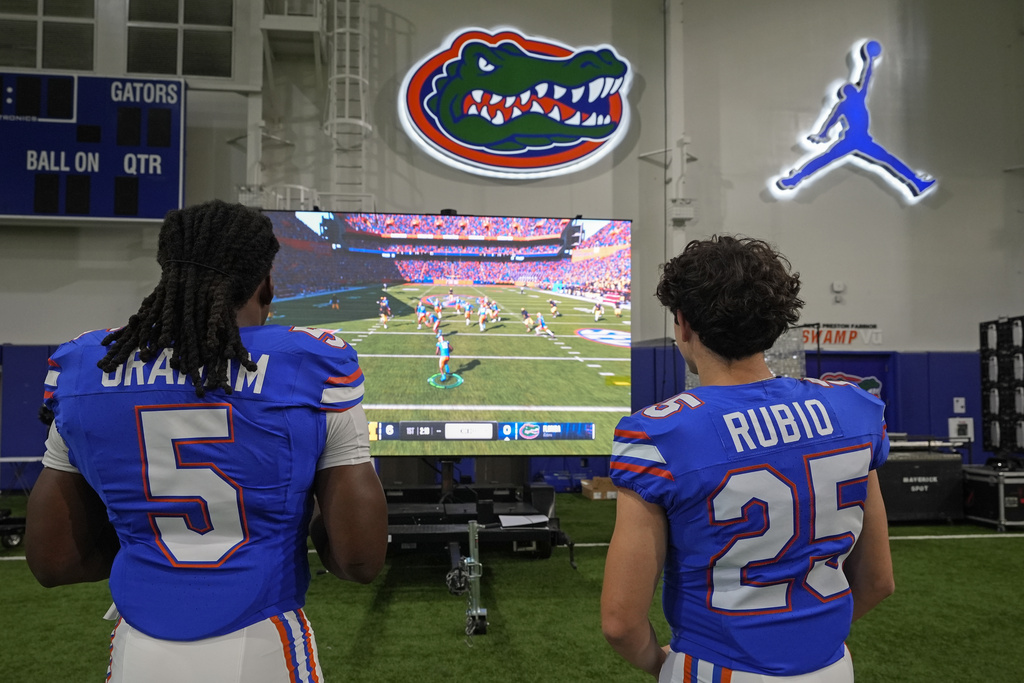 Image shows Florida linebacker Myles Graham (5) and Anthony Rubio (25) competing in the EA Sports video game College Football 25 at the University of Florida, Tuesday, July 23, 2024, in Gainesville, FL.