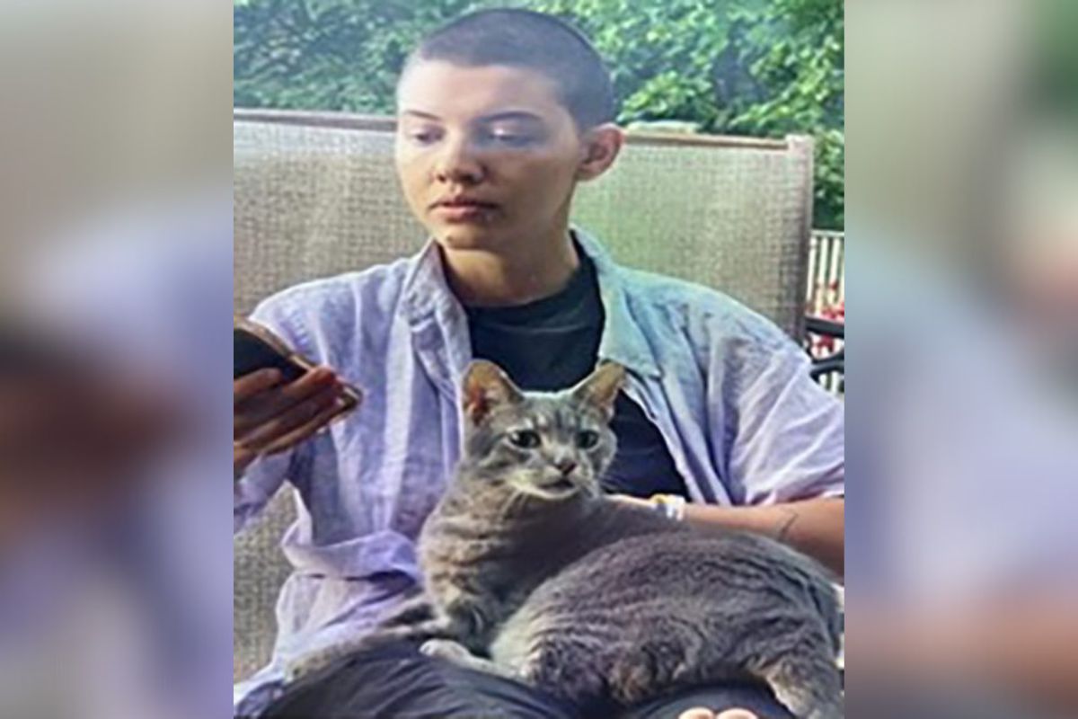 Image shows missing woman 29-year-old Rosemary Emmerling with a cat on her lap.