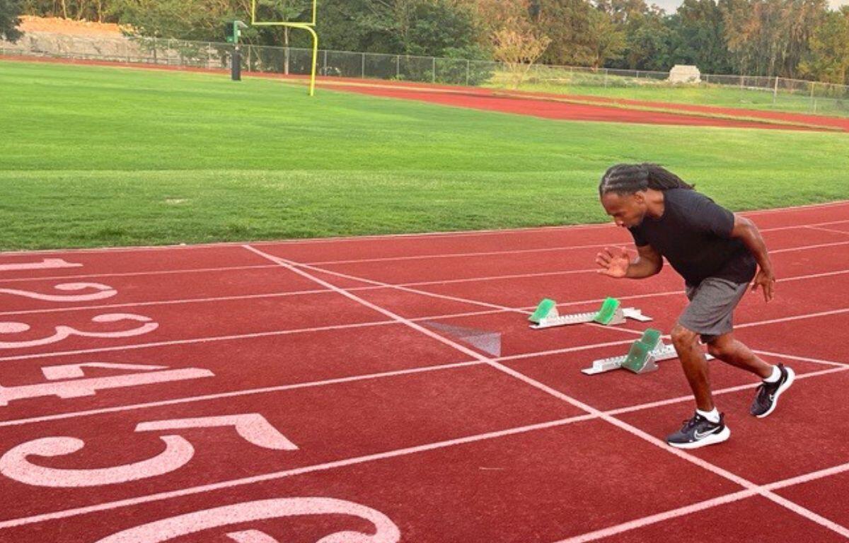Image shows paralympic athlete Marshall Zackery on the track at Dunlap Field at Trinity Catholic High School in Ocala.