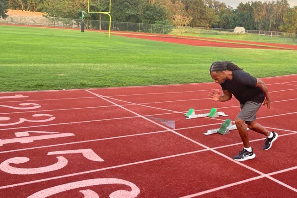 Image shows paralympic athlete Marshall Zackery on the track at Dunlap Field at Trinity Catholic High School in Ocala.
