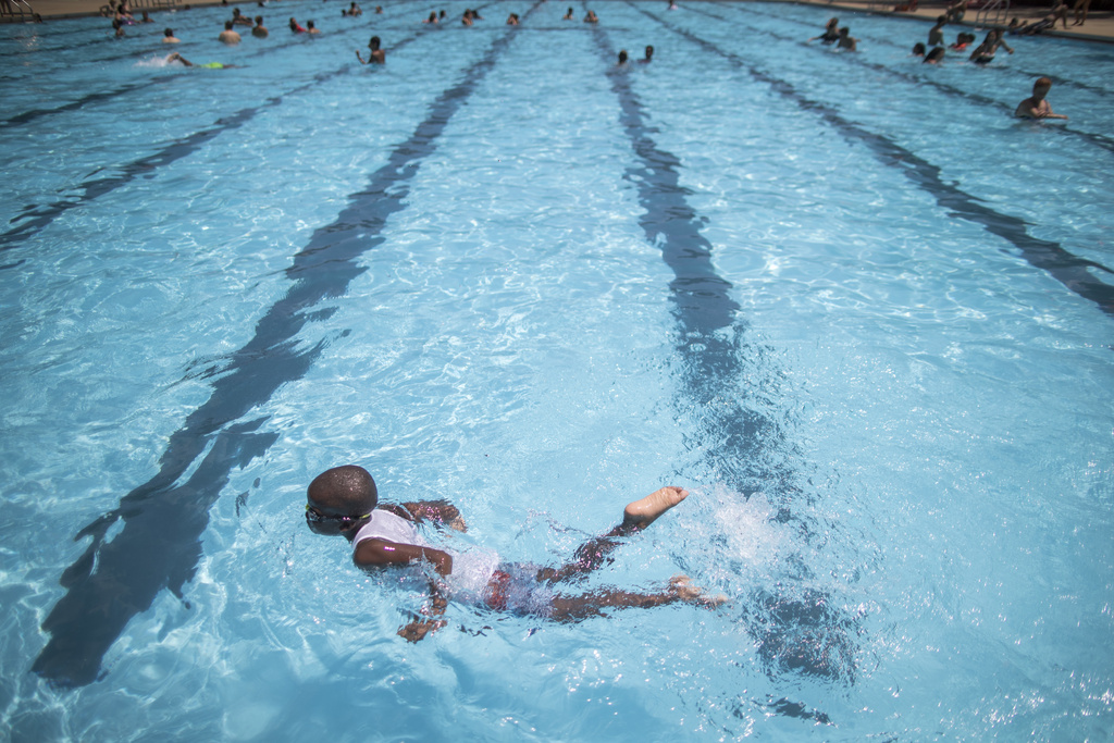 A child swims in a pool.