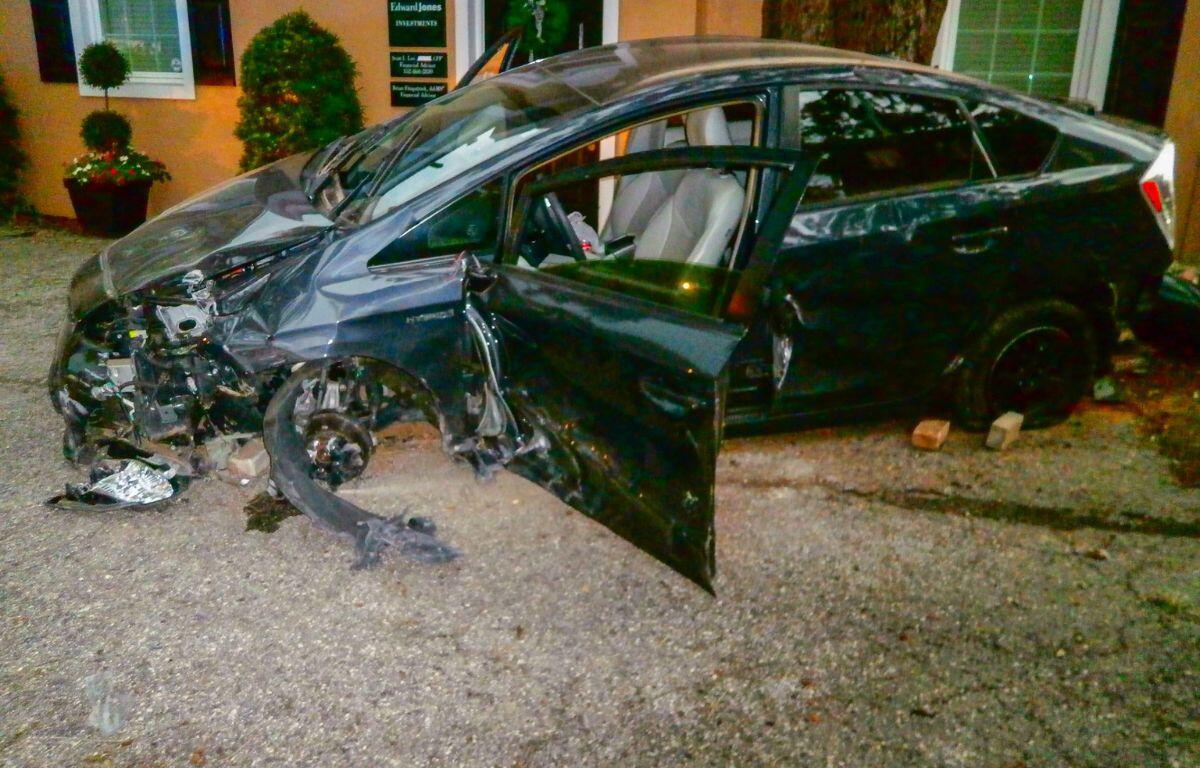 Photo shows wrecked Toyota Prius.