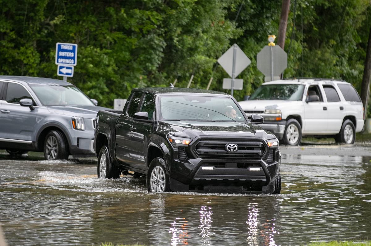 Trucks try the water along Three Sisters Trail after Hurricane Debby passed Crystal River, FL on Monday, August 5, 2024. T