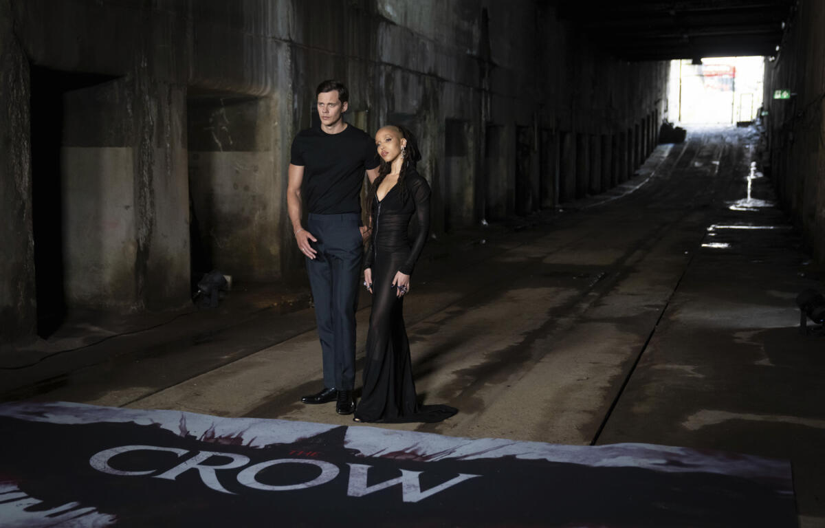 Bill Skarsgard, left, and FKA Twigs pose for photographers upon arrival at the photo call for the film 'The Crow' in London.