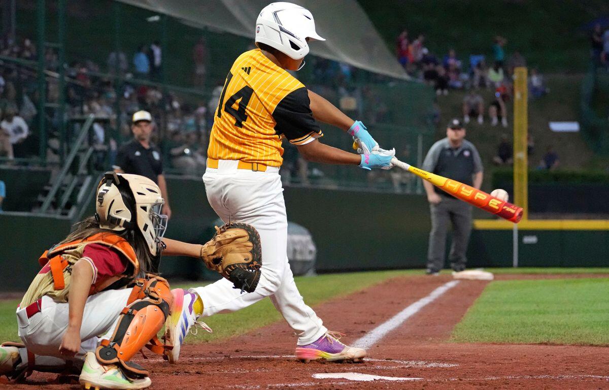 Lake Mary's James Feliciano (14) hits a solo home run.
