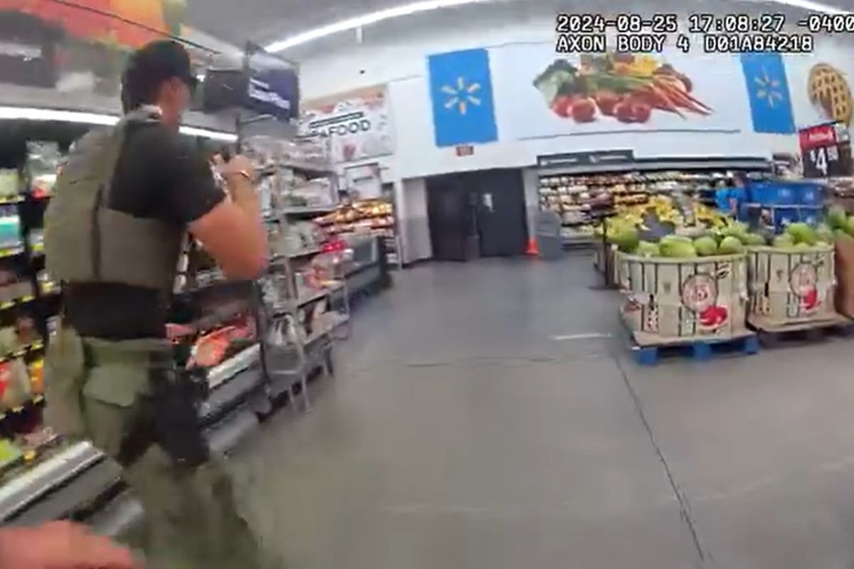 Body camera footage as deputies chase Joshua Comer through the produce section at the Dunnellon Walmart.