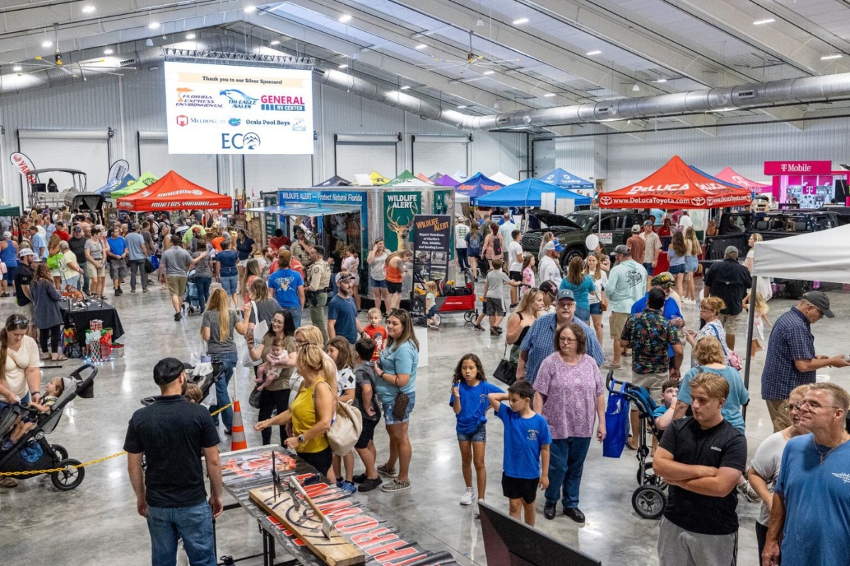 Visitors enjoy the booths and displays at the NCFL Outdoor Expo at the World Equestrian Center in Ocala.