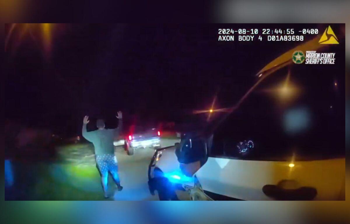 Photo shows MCSO deputy arresting a 14-year-old suspected of carjacking at man at gunpoint.