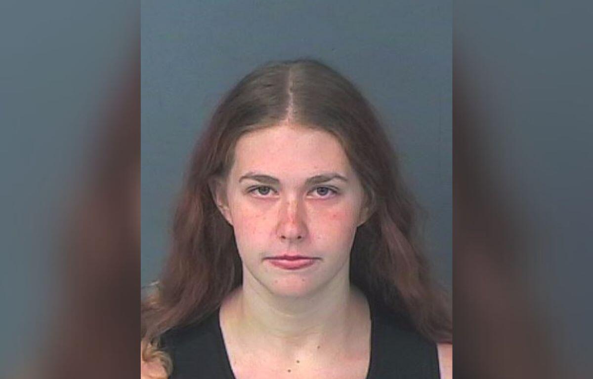 Woman arrested and charged with child abuse.