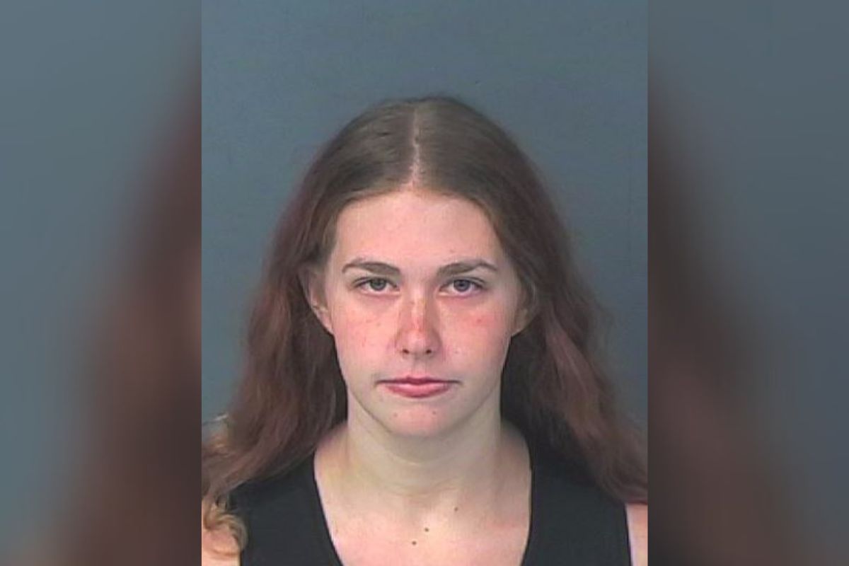 Woman arrested and charged with child abuse.