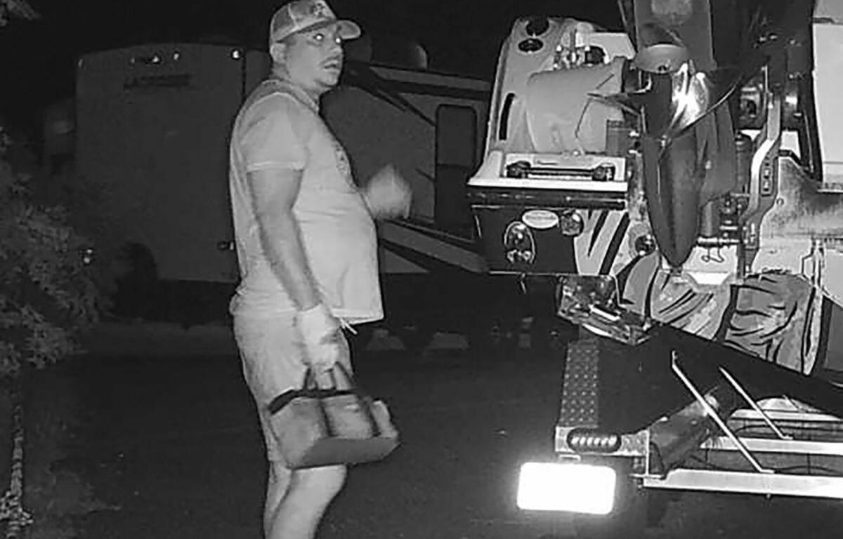 Photo shows man as he is captured on camera breaking into a boat and RV storage facility.
