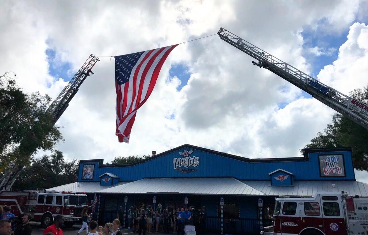 American flag flying over Mojo Grill & Catering, Ocala, FL