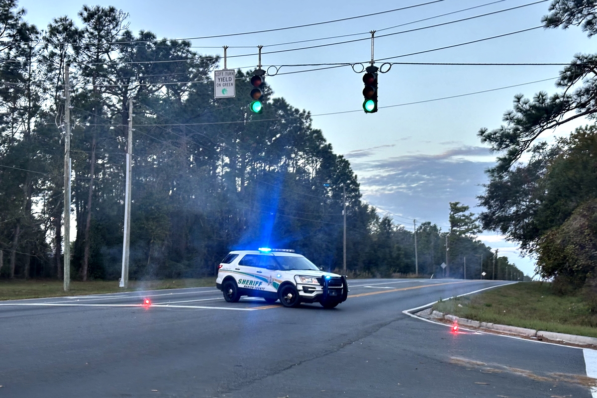 Photo of Marion County Sheriff's Office cruiser blocking the entrance to Del Webb off CR 25 in the Belleview area after a woman was hit by a car while walking.