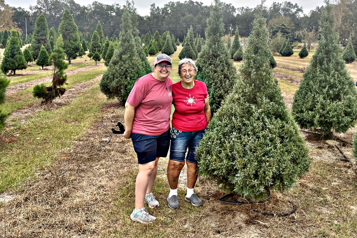 Melissa Thompson and Ann Murray showcase the beautiful Carolina Sapphire trees at Nicholas' Christmas Tree Farm.