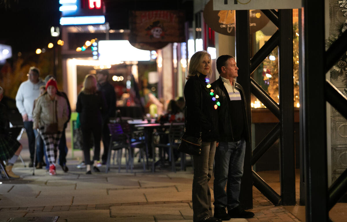 Visitors window shop during First Friday Art Walk.