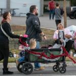 Fans hunt for a place to sit before the annual Ocala Christmas Parade.