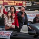 Ocala Mayor Ben Marciano and his family wave at the crowd during the annual Ocala Christmas Parade.