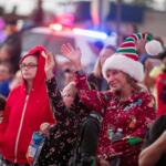 Fans wave at the parade.
