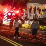 Kids play in the fake snow AdventHealth broadcast into the crowd during the annual Ocala Christmas Parade.