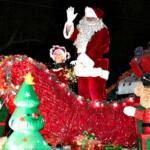 Santa waves to fans as he is the last float during the annual Ocala Christmas Parade.