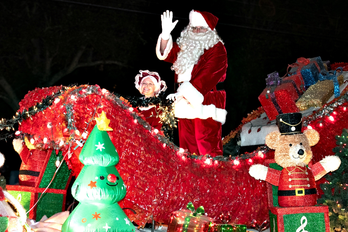 Santa waves to fans as he is the last float during the annual Ocala Christmas Parade.