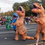 T-Rex and Triceratops. lead the parade route during the annual Ocala Christmas Parade.
