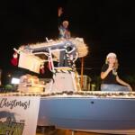 Scott Chase and Hunter from the Hunter from Wind-FM entertained the crowd during the annual Ocala Christmas Parade