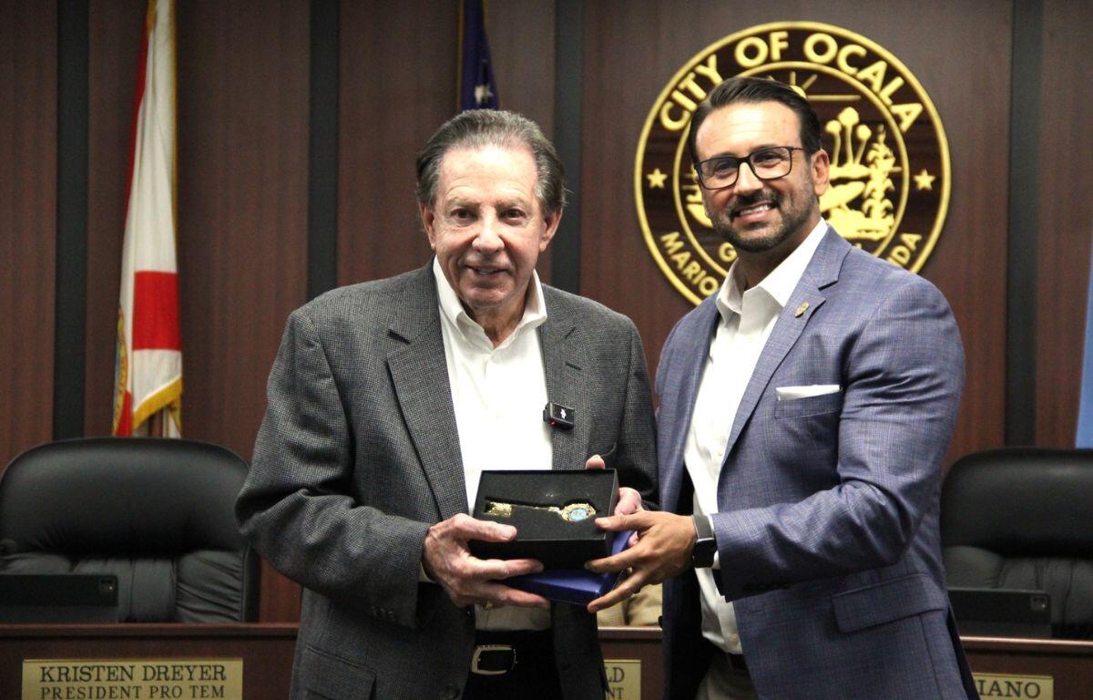 Frank DeLuca receiving the Key to the City from Ocala Mayor Ben Marciano.