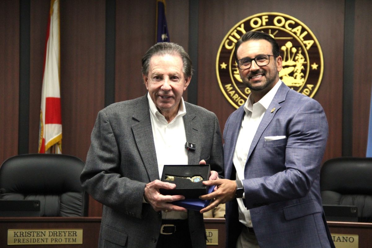 Frank DeLuca receiving the Key to the City from Ocala Mayor Ben Marciano.