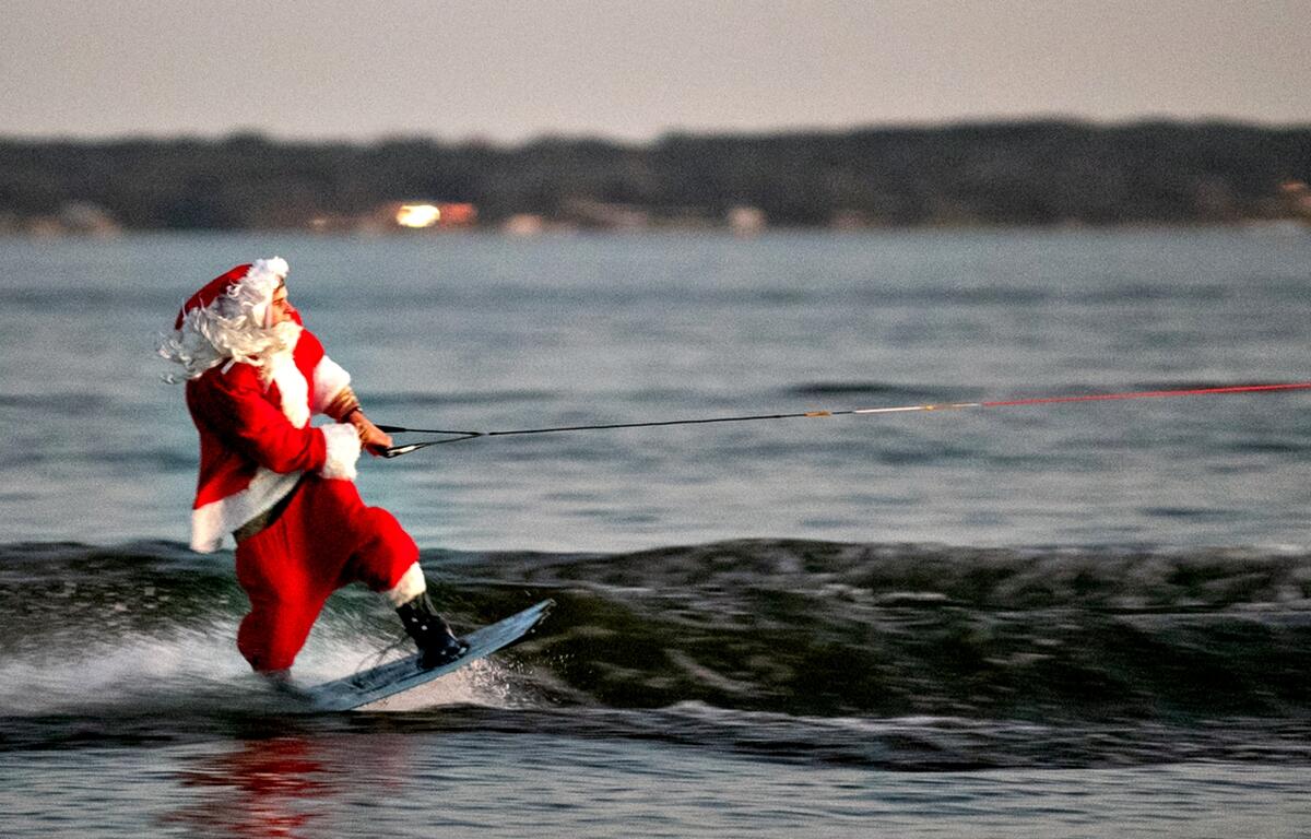Water ski Santa delights crowds during annual Lake Weir holiday boat parade. Courtesy: Alan Youngblood/352today