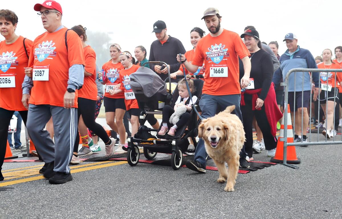 Runners take off through thick Thanksgiving morning fog at the 29th Annual Frank DeLuca YMCA Turkey Trot in Ocala, bringing together nearly 1,900 participants for fitness, fun, and community spirit.