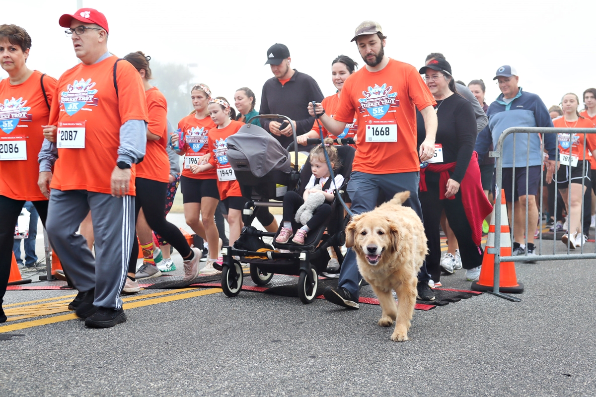 Runners take off through thick Thanksgiving morning fog at the 29th Annual Frank DeLuca YMCA Turkey Trot in Ocala, bringing together nearly 1,900 participants for fitness, fun, and community spirit.