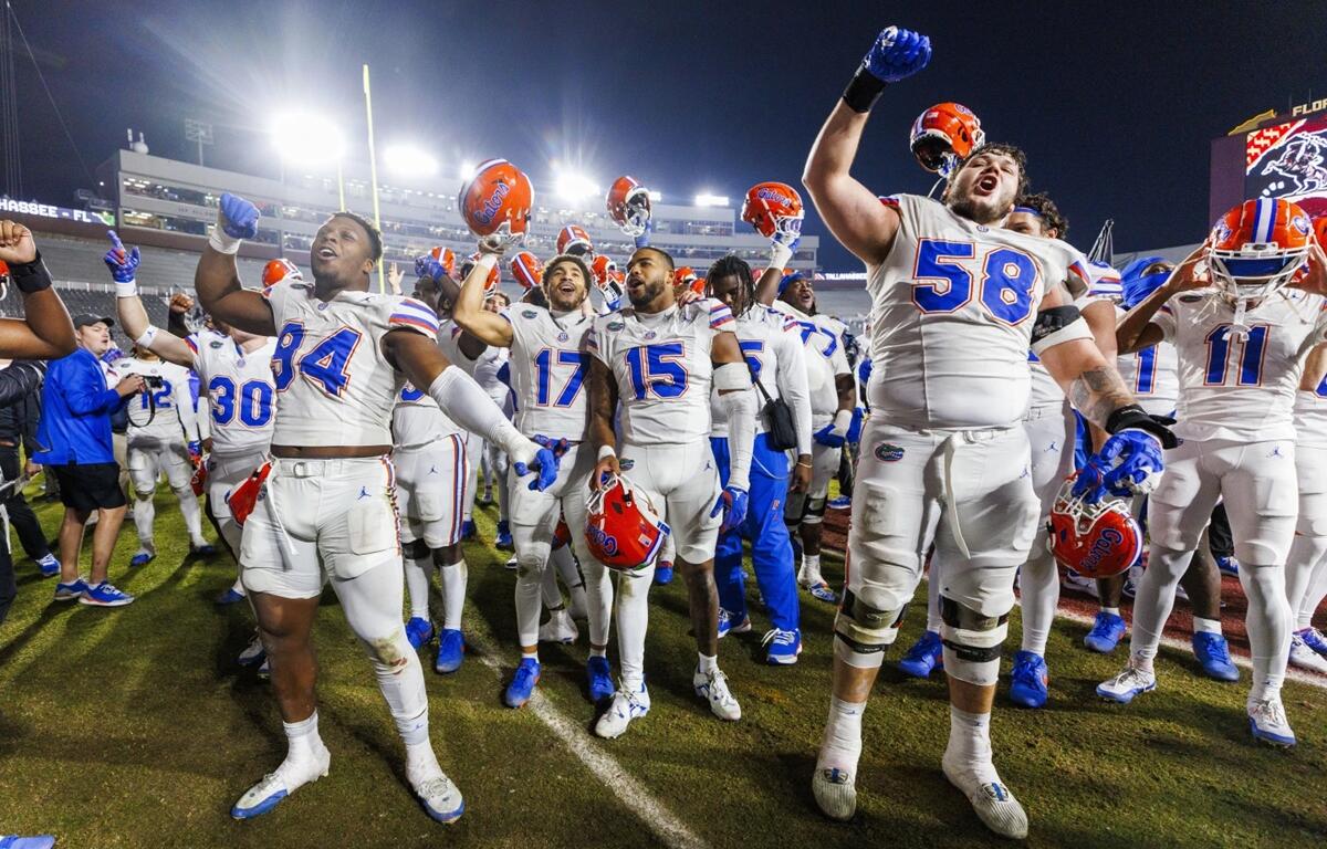 Florida players celebrate after defeating Florida State 31-11 after a NCAA college football game Saturday, Nov. 30, 2024, in Tallahassee.