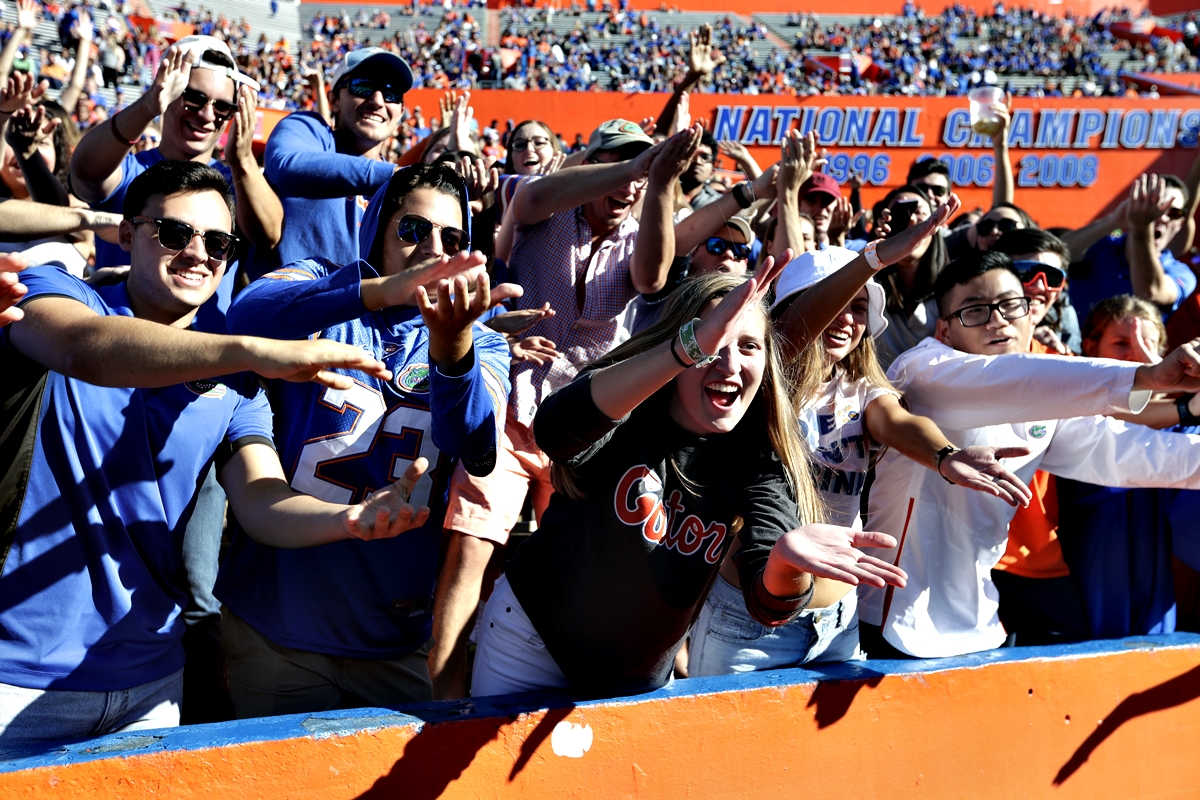 Florida fans do the 'Gator Chomp' as they cheer during the second half of an NCAA college football game against Idaho, Saturday, Nov. 17, 2018, in Gainesville, FL.