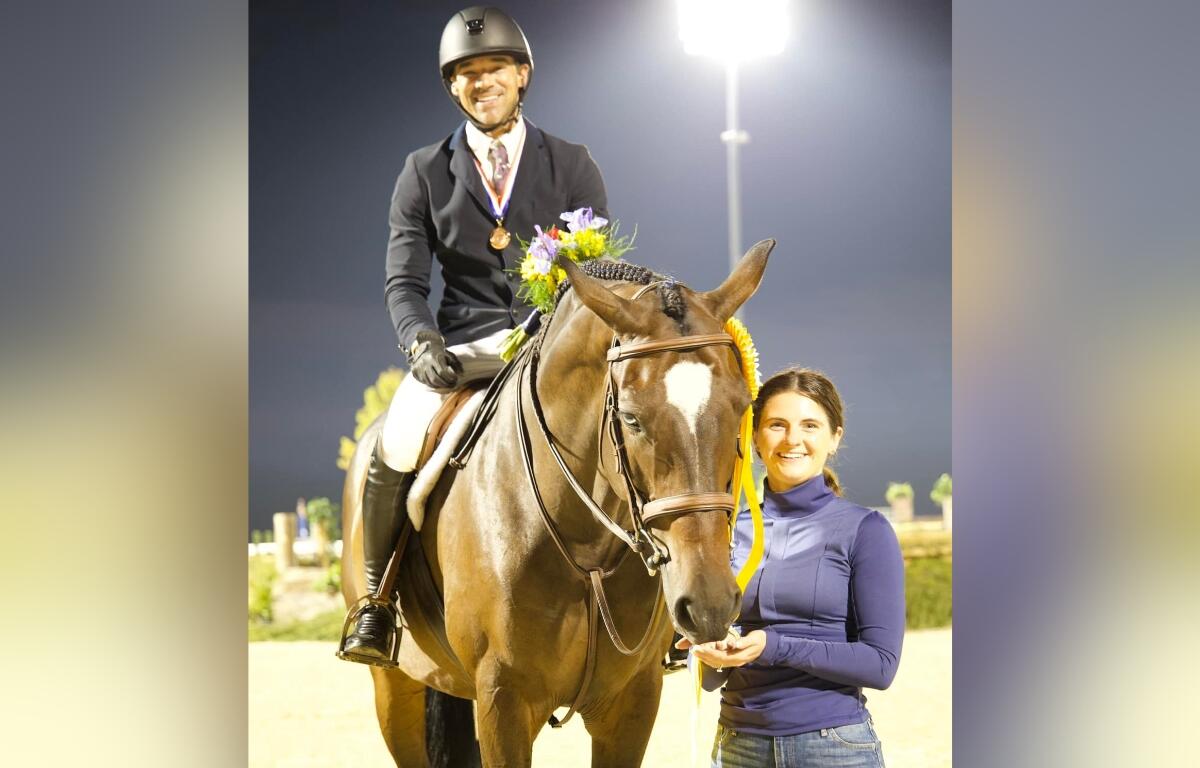 Ocala-based rider Josh Dolan with Something Blue and manager Brandi Cariss, showcasing their strong partnership in the equestrian world.