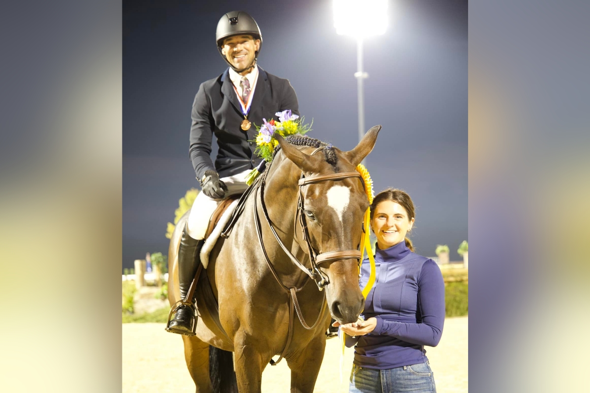 Ocala-based rider Josh Dolan with Something Blue and manager Brandi Cariss, showcasing their strong partnership in the equestrian world.
