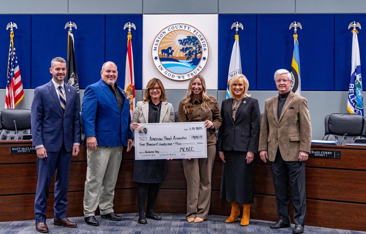 Marion County employees celebrate a record-breaking $12,273.39 raised during Jamboree Day to benefit the American Heart Association, March of Dimes, and United Way of Marion County.