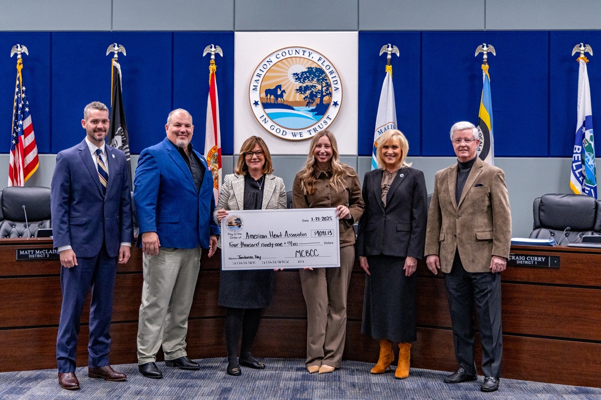 Marion County employees celebrate a record-breaking $12,273.39 raised during Jamboree Day to benefit the American Heart Association, March of Dimes, and United Way of Marion County.