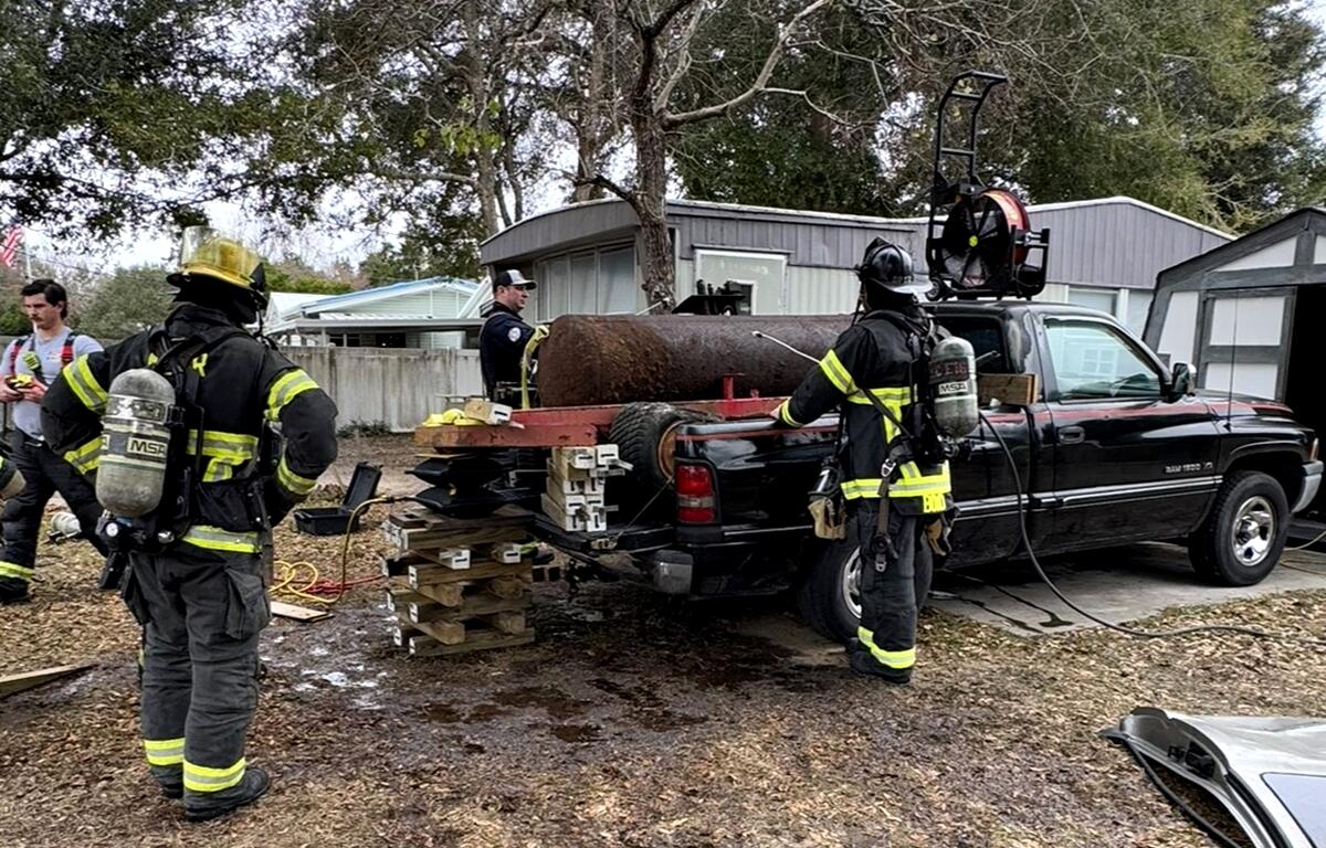 HAZMAT crews remove fuel from the leaking tank to ensure the area is safe for residents and first responders.