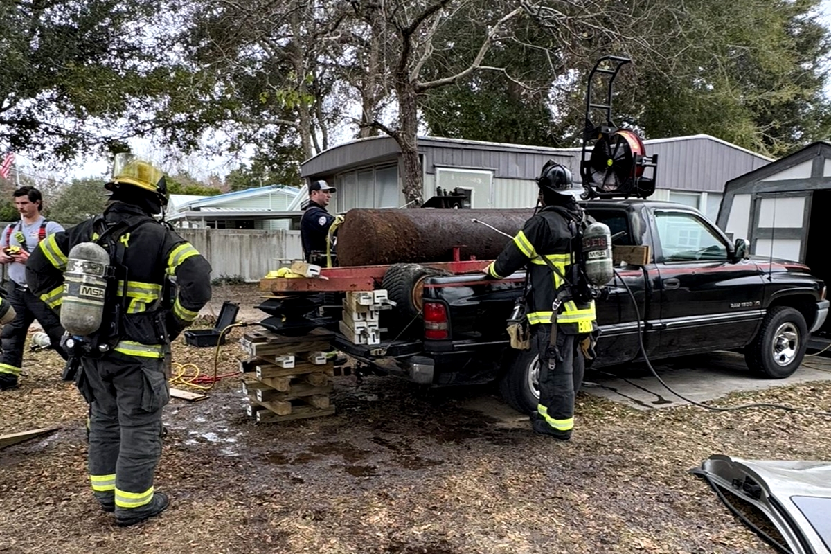 HAZMAT crews remove fuel from the leaking tank to ensure the area is safe for residents and first responders.