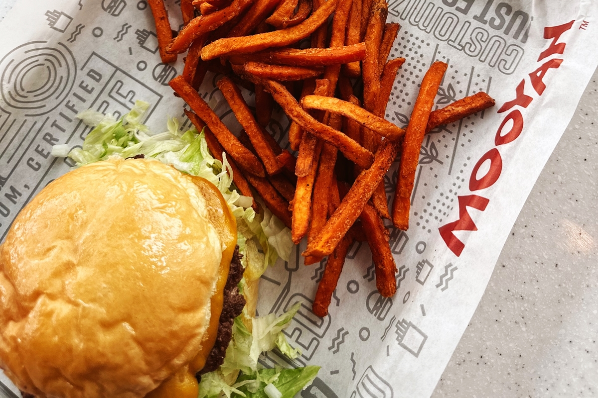 Brad and Jessica Harper invite the community to celebrate the grand opening of MOOYAH Burgers, Fries & Shakes in Downtown Ocala on Feb. 14, 2025.
