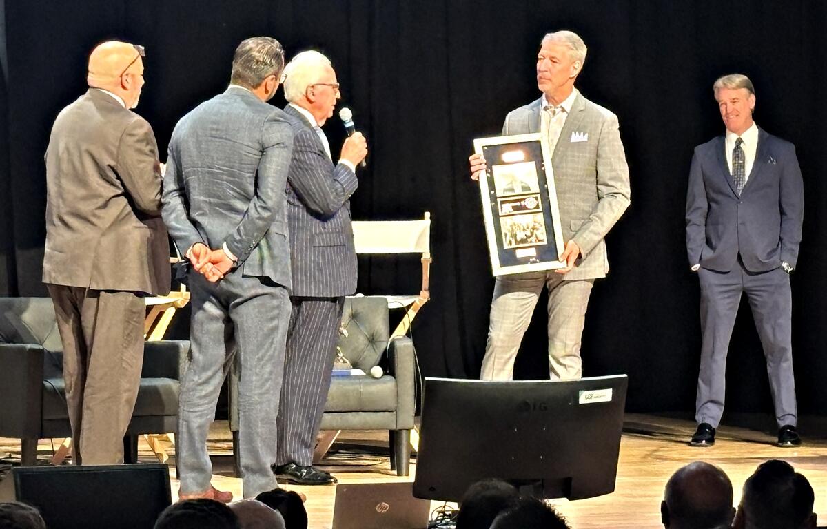 Ocala Metro CEP President and CEO Kevin Sheilley accepts a plaque and key to the city from former Ocala Mayor Kent Guinn and current Mayor Ben Marciano.